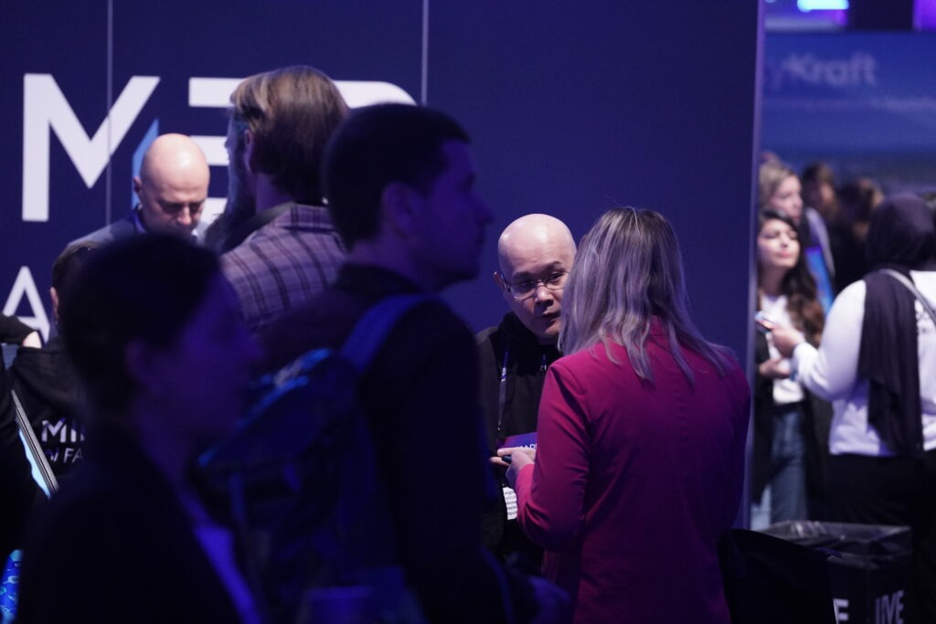 Visitors gathered at the Mimer AI Factory booth engaging in discussions during TechArena 2026.