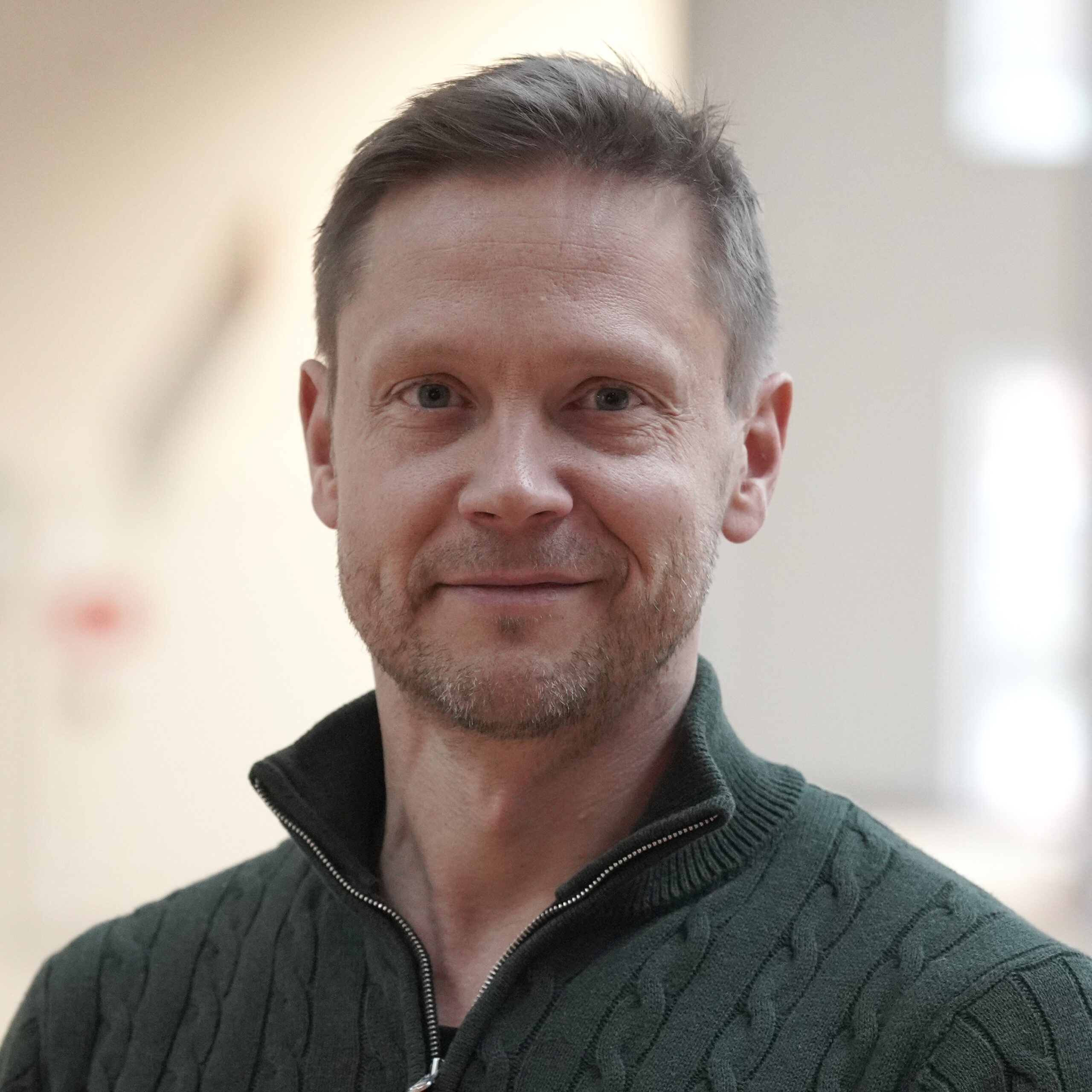 Portrait of man smiling with blurred backgorund