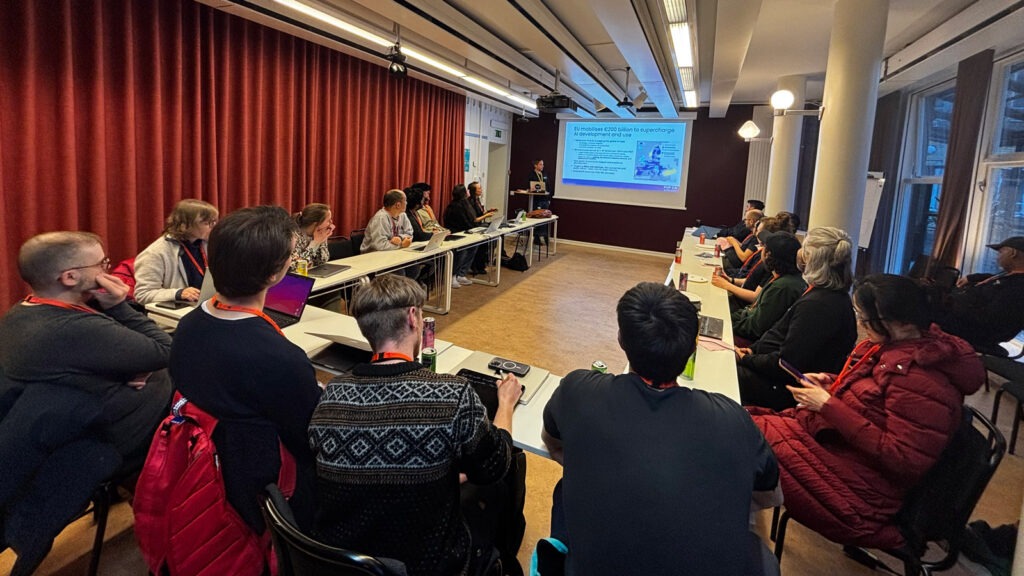 People in meeting room listening to presentation
